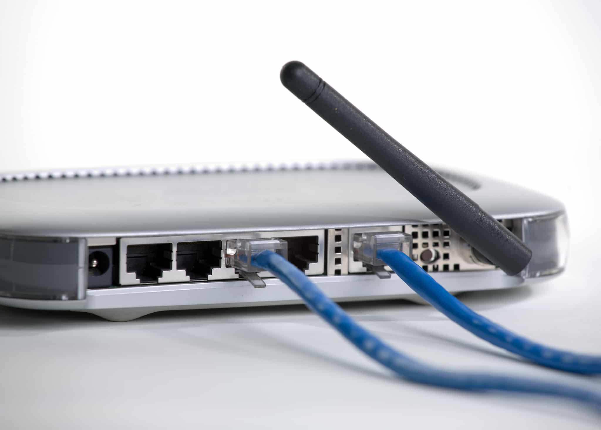 The back (ports) of a wireless router against a white background.