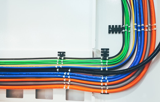 Pneumatic and electrical cables pinned to the machine