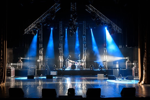 Stage lit with blue overhead lights