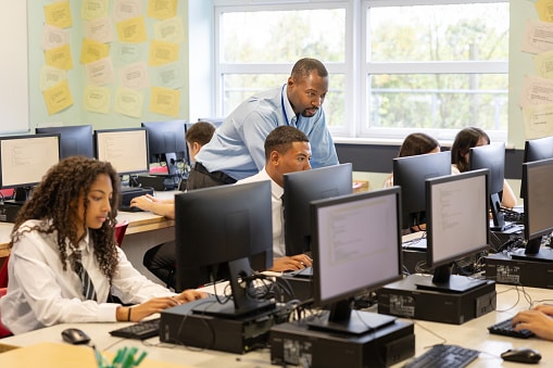 High school students in modern computer filled classroom