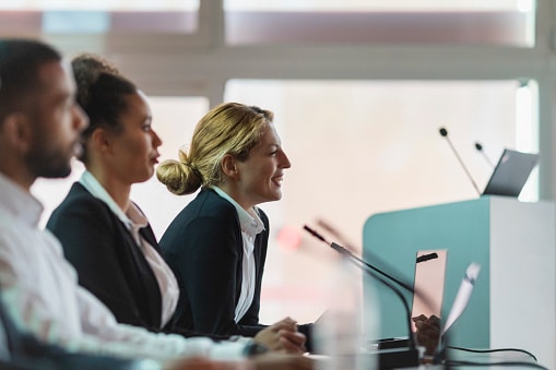 Committee members at a conference in the board room